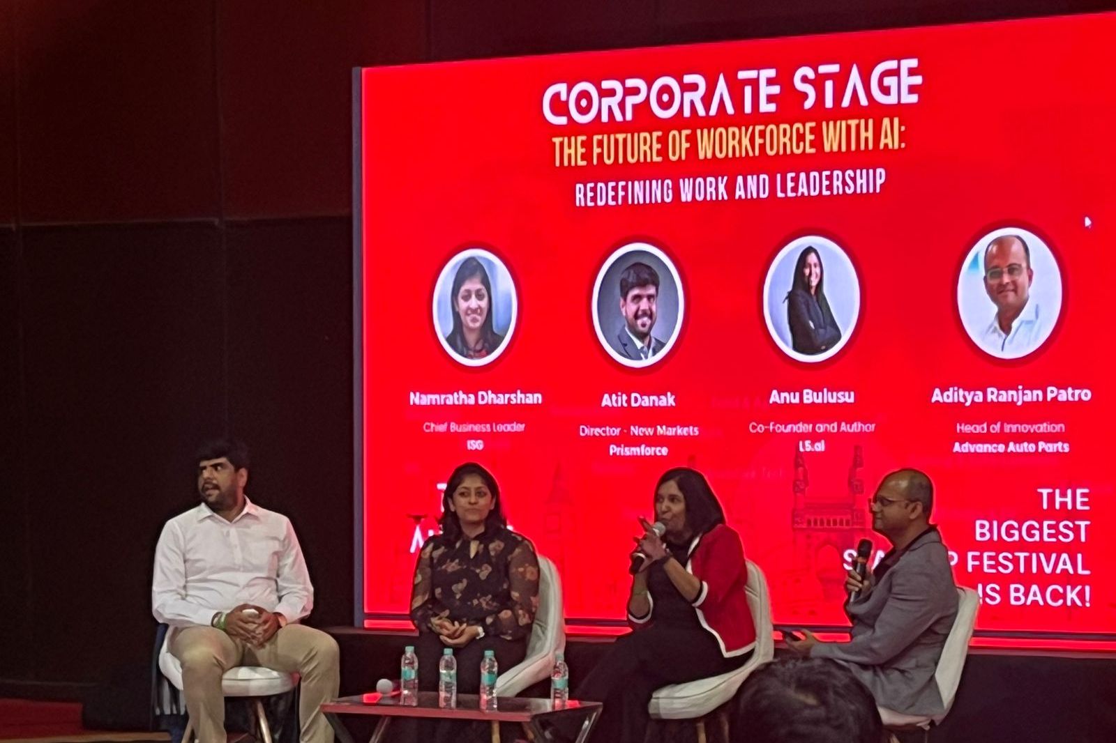 Anu Bulusu speaking on a four-person panel on the Corporate Stage at August Fest 2025
